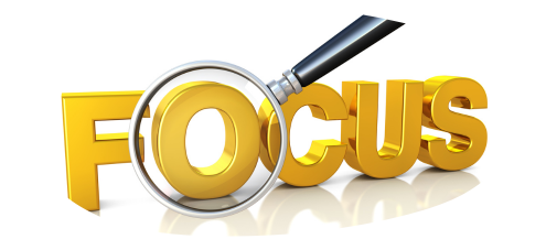 Focus in large yellow letters with the O highlighted by a magnifying glass