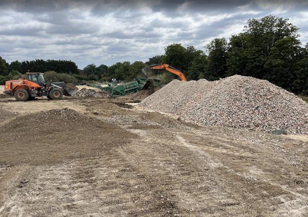 Piles of stone material to be crushed and used for footpaths