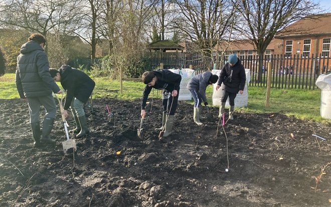 Students planting Desborough Rec Tiny Forest