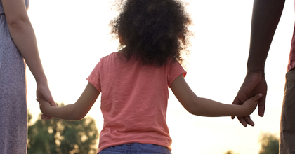 adoption hand holding