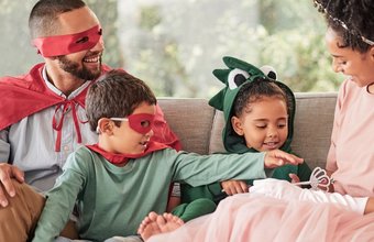 family-children-halloween-with-kids-parents-costume-while-sitting-sofa-living-room-their-home-love-imagination-celebration-with-brother-sister-dressing-up-resized