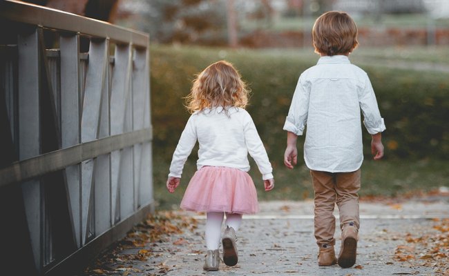 Siblings walking together
